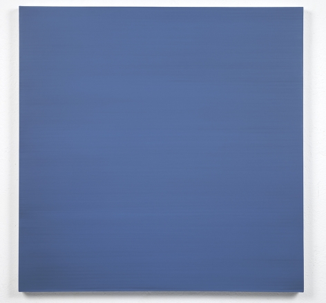 Blue square painting hanging on white wall