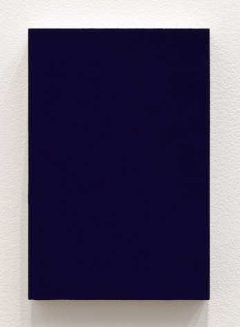 Dark blue rectangle painting hanging on white wall