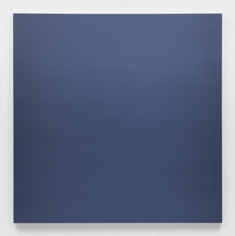 Dark gray-blue square painting hanging on white wall